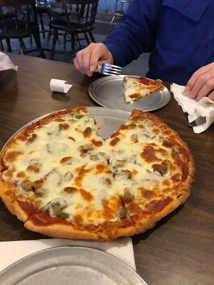 A cheese pizza fresh from The Hound's kitchen