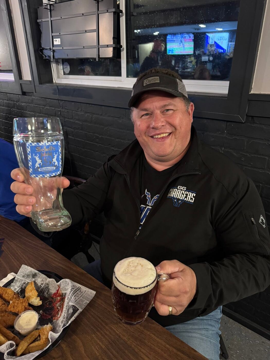 A regular raising a stein at The Hound