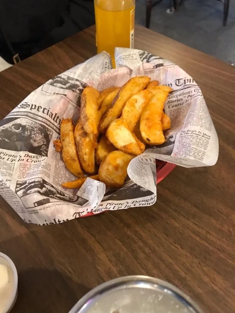 A basket of seasoned fries at The Hound